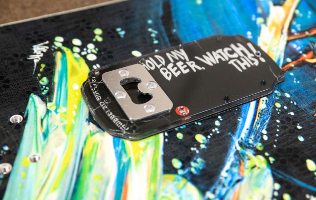 Oneball Hold My Beer Stomp Pad - A black stomp pad with a silver metal "hold my beer" logo in the center.