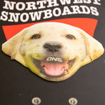 Oneball Lab Stomp Pad 2022-2023 - A white dog's face with a black nose and mouth, wearing a red hat.