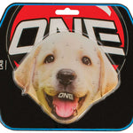 Oneball Lab Stomp Pad - A tan-colored dog with a black nose and dark eyes is looking directly at the camera, its mouth slightly open as if smiling.