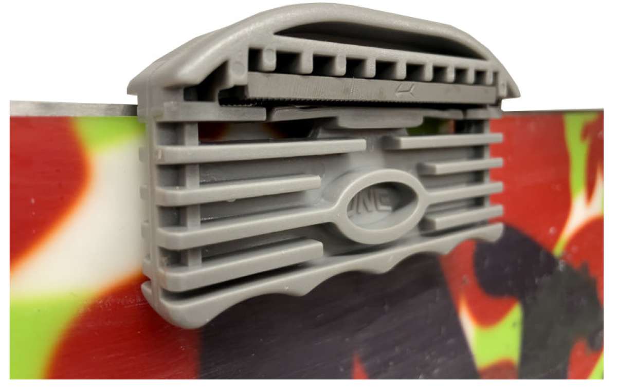 Oneball Large Edge Tool 2024 - A gray plastic tool with a rounded top and flat bottom, featuring a small oval-shaped hole in the center.