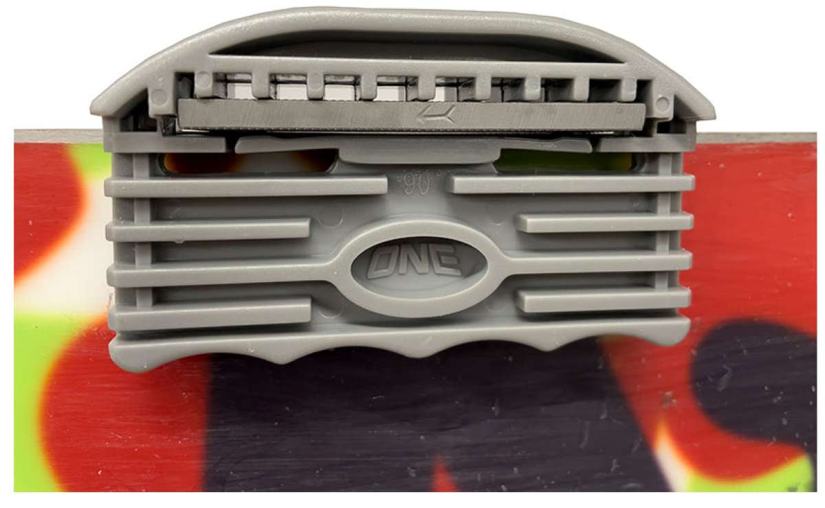 Oneball Large Edge Tool 2024 - A gray plastic tool with a rounded top and an oval-shaped logo that reads "ONE" in the center.