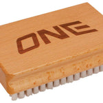 Oneball Nylon Brush 2024 - A light-colored brush with nylon bristles and a rectangular wooden handle.