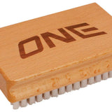 Oneball Nylon Brush 2024 - A light-colored brush with nylon bristles and a rectangular wooden handle.