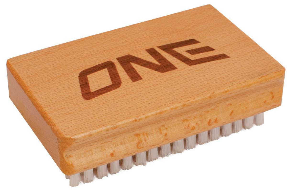 Oneball Nylon Brush 2024 - A light-colored brush with nylon bristles and a rectangular wooden handle.