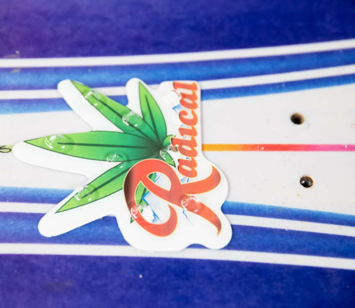 Oneball Radical Leaf Stomp Pad - A green cannabis leaf with black lines is printed on a white background.