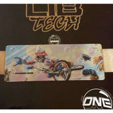 Oneball Radical Rick Stomp Pad - A black stomp pad with a cartoon image of a man wearing a red and white striped shirt, blue jeans, and sunglasses riding a skateboard on it.