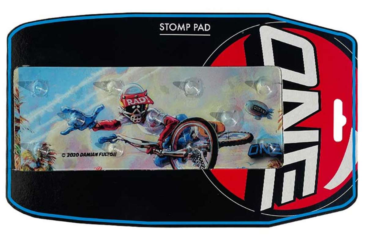 Oneball Radical Rick Stomp Pad - A blue stomp pad with a cartoon character riding a skateboard on it.
