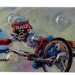 Oneball Radical Rick Stomp Pad - A blue cartoon character with a red shirt and helmet, riding a snowboard down a mountain.