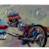 Oneball Radical Rick Stomp Pad - A blue cartoon character with a red shirt and helmet, riding a snowboard down a mountain.