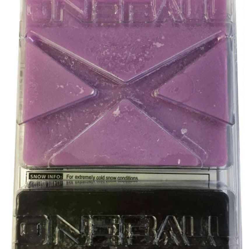 Oneball X-Wax Cold 21 - 5F 2024 - Purple wax with a cross-shaped logo on top.