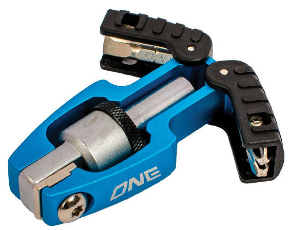 Oneball X-Wing Driver 2022-2023 - A black plastic tool with a silver metal tip and a small, round knob on top.