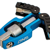 Oneball X-Wing Driver 2022-2023 - A black plastic tool with a silver metal tip and a small, round knob on top.