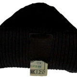 Outdoor Tech Chips Shred Audio Beanie - A black beanie with a white logo on the front and an earphone cord wrapped around it.
