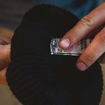 Outdoor Tech Chips Shred Audio Beanie - A black beanie with a small silver-colored audio jack on the cuff.