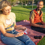 Outdoor Tech Twin Peaks Portable Speaker - Black speaker with white logo on top and red accents.