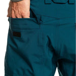 Quiksilver Porter Insulated Pant 2024 - A pair of insulated pants with a zippered pocket on the side and a black logo patch near the bottom hem.