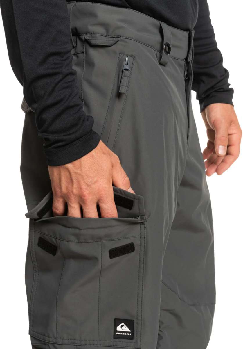 Quiksilver Porter Insulated Pant 2024 - A pair of dark gray insulated pants with a zippered pocket on the side and a black logo patch near the bottom hem.