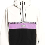 Quiksilver Steeze Shell Jacket 2024 - A white jacket with a black stripe across the chest and a purple patterned band above it.