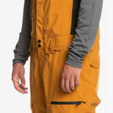 Quiksilver Utility Shell Bib - Bib pants with black zippers, pockets, and buckles on a gray background.