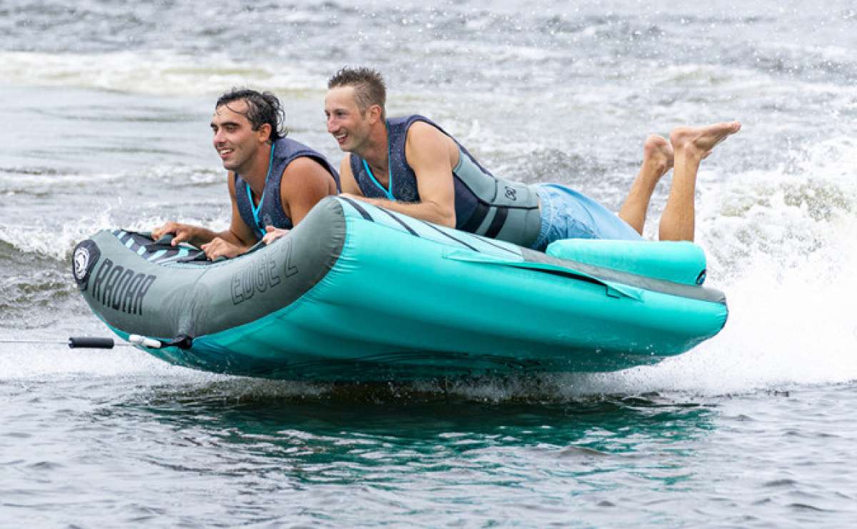 Radar Edge 2 Inflatable Towable Tube 2022 - Blue tube with black stripes and white lettering, floating on water.