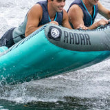 Radar Edge 2 Inflatable Towable Tube 2022 - A blue and gray inflatable tube with a black logo on the front, floating in water.