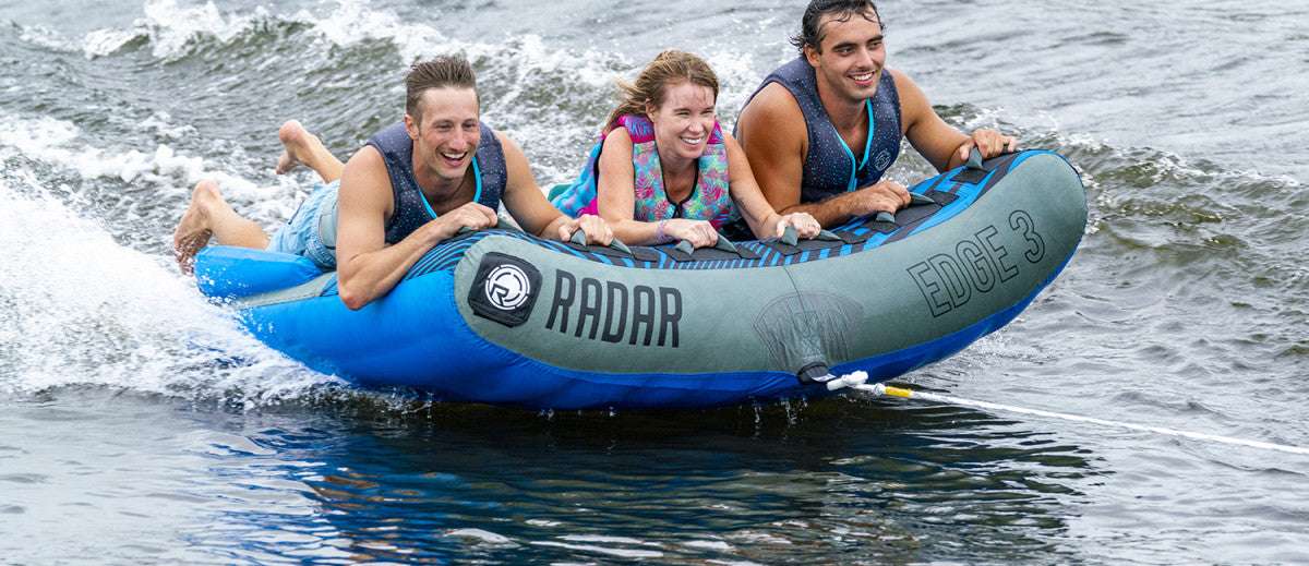 Radar Edge 3 Inflatable Towable Tube 2022 - Blue tube with black and white logo on top, floating in water.