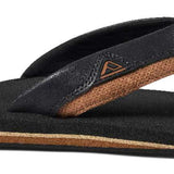 Reef Cushion Dawn Sandal 2022 - A pair of black sandals with a tan-colored sole and strap.