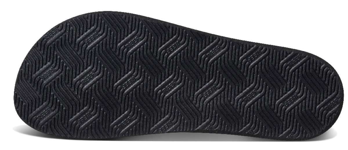 Reef Cushion Dawn Sandal 2022 - Black rubber sole with a textured tread pattern and diagonal ridges.