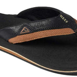 Reef Cushion Dawn Sandal 2022 - A pair of black sandals with a tan sole and strap.