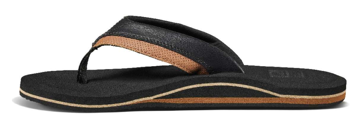 Reef Cushion Dawn Sandal 2022 - A pair of black sandals with a tan strap and sole.