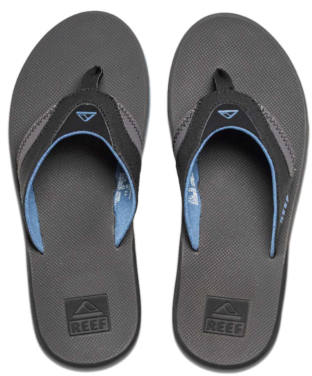 Reef Men's Fanning Sandal - A pair of brown sandals with a strap and toe post, featuring a logo on the top strap.