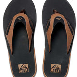 Reef Men's Fanning Sandal - A pair of brown sandals with a strap and toe post, featuring a logo on the top strap.