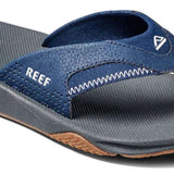 Reef Men's Fanning Sandal - A pair of blue sandals with a white logo on the strap, featuring a textured sole and a woven upper portion.