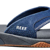 Reef Men's Fanning Sandal - A pair of blue sandals with a strap that goes between the big and second toe, featuring a white logo on the strap.