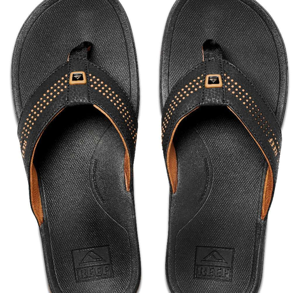 Reef Ortho-Seas Sandal - A pair of black sandals with a strap across the top and a small logo on it.