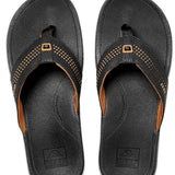 Reef Ortho-Seas Sandal - A pair of black sandals with a strap across the top and a small logo on it.