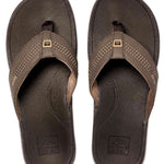 Reef Ortho-Seas Sandal - A pair of brown sandals with a strap and toe post, featuring a small logo on the top strap.