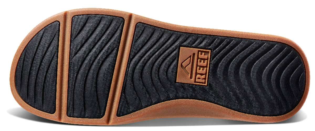 Reef Ortho-Seas Sandal - A pair of brown sandals with a thick sole and straps, featuring a textured pattern on the strap.