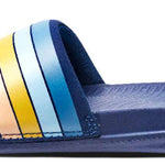 Reef X Life Is Good Women's Slide 2022 - A pair of women's slides with a blue sole and strap, featuring a wave logo on the side in shades of orange and yellow.