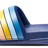 Reef X Life Is Good Women's Slide 2022 - A pair of women's slides with a blue sole and strap, featuring a wave logo on the side in shades of orange and yellow.