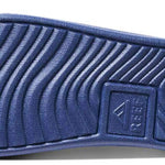 Reef X Life Is Good Women's Slide 2022 - A blue slide sandal with a textured strap and a logo on the side.