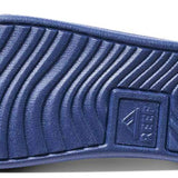 Reef X Life Is Good Women's Slide 2022 - A blue slide sandal with a textured strap and a logo on the side.