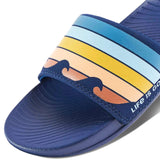 Reef X Life Is Good Women's Slide 2022 - A pair of blue slide sandals with a wave design on the strap.