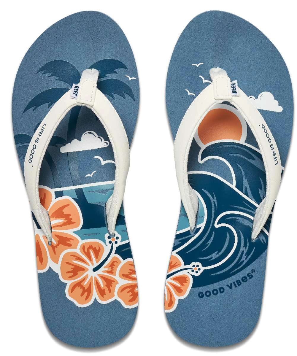 Reef Women's X Life Is Good Sandal - A pair of sandals with a palm tree and clouds printed on them in shades of blue, white, and orange.