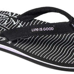 Reef Women's X Life Is Good Sandal - A black sandal with white stripes and a palm tree design on the strap.