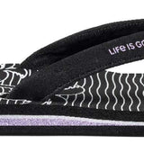 Reef Women's X Life Is Good Sandal - A black sandal with a white logo on top of the footbed and a palm tree design on the strap.