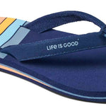 Reef Women's X Life Is Good Sandal - A pair of navy blue sandals with a light orange logo on the strap.