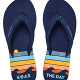 Reef Women's X Life Is Good Sandal - A pair of navy blue sandals with a yellow logo on the strap.