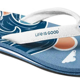 Reef Women's X Life Is Good Sandal - A pair of blue sandals with white straps and a peach-colored logo on the strap.