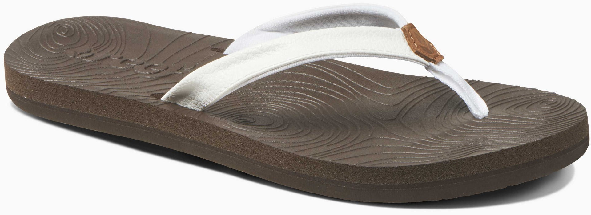 Reef Women's Zen Love Sandal 2020 - A pair of white sandals with a brown strap and sole, featuring a circular pattern on the strap.